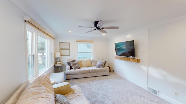 carpeted living area with baseboards, visible vents, recessed lighting, and a ceiling fan