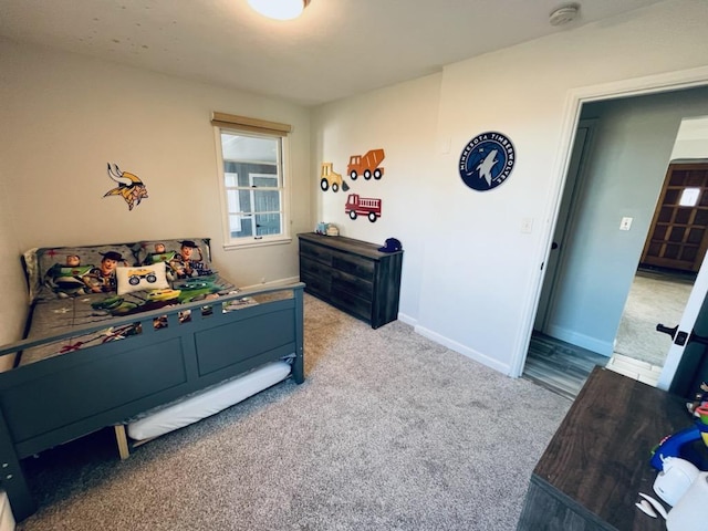 carpeted bedroom with baseboards