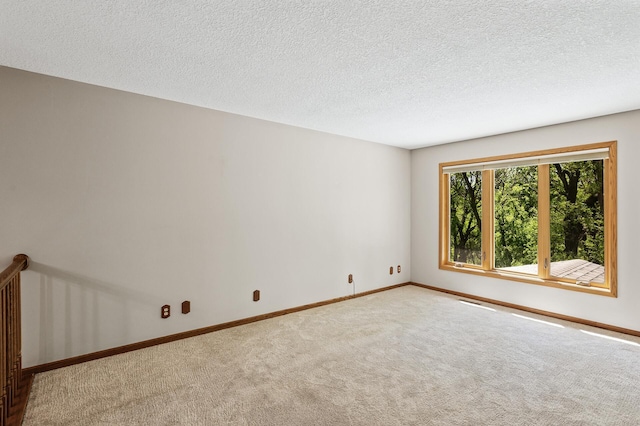13838 Glendale Trl, Savage, MN 55378 - empty room featuring carpet flooring, baseboards, and a textured ceiling