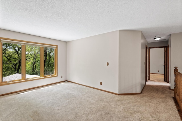 13838 Glendale Trl, Savage, MN 55378 - carpeted spare room with baseboards and a textured ceiling