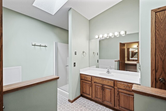 13838 Glendale Trl, Savage, MN 55378 - full bathroom featuring a shower stall, vanity, a skylight, and baseboards