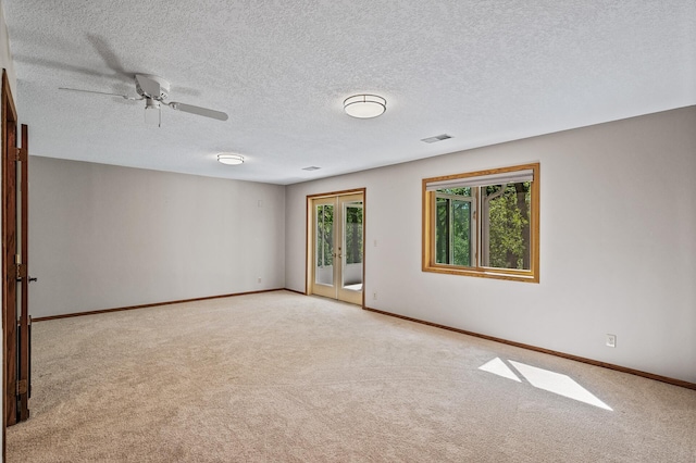 13838 Glendale Trl, Savage, MN 55378 - unfurnished room featuring light colored carpet, baseboards, a ceiling fan, and a textured ceiling