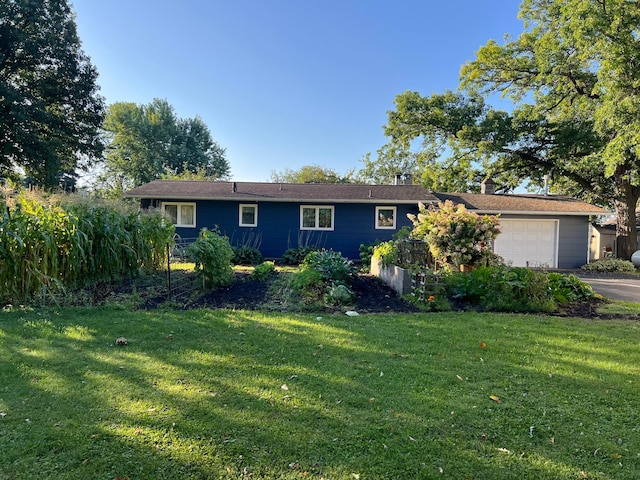 1778 Wabanica Bay Dr NW, Baudette, MN 56623 - view of front of home with aphalt driveway, a garage, a chimney, and a front yard