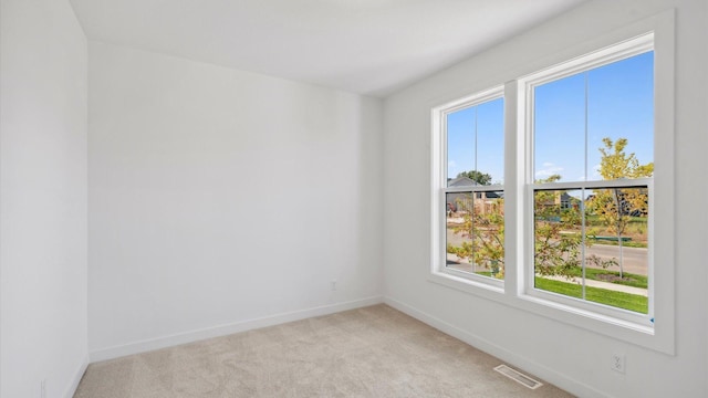 2133 Westpointe Dr, Hastings, MN 55033 - empty room with healthy amount of natural light, baseboards, and light colored carpet