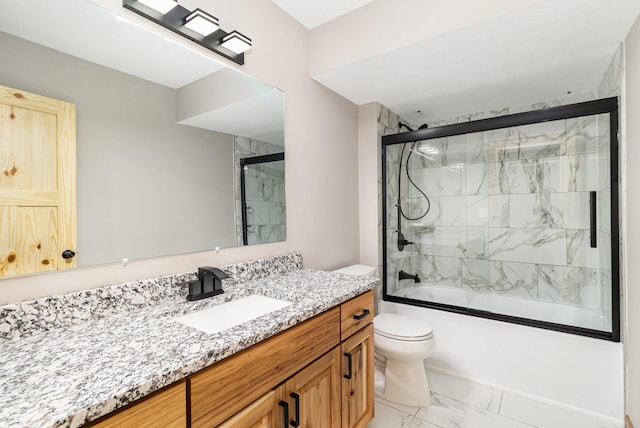 575 Elins Lake Rd SE, Cambridge, MN 55008 - bathroom with marble look tiles, toilet, vanity, and combined bath / shower with glass door
