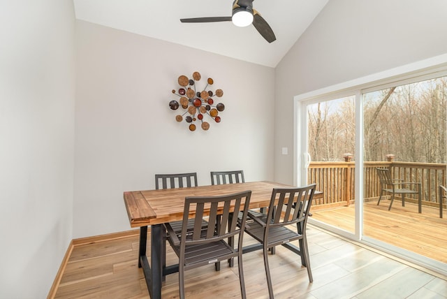 575 Elins Lake Rd SE, Cambridge, MN 55008 - dining room with a ceiling fan, light wood-type flooring, high vaulted ceiling, and baseboards