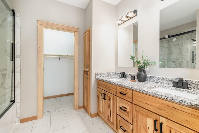 575 Elins Lake Rd SE, Cambridge, MN 55008 - bathroom featuring marble finish flooring, an enclosed shower, baseboards, and double vanity