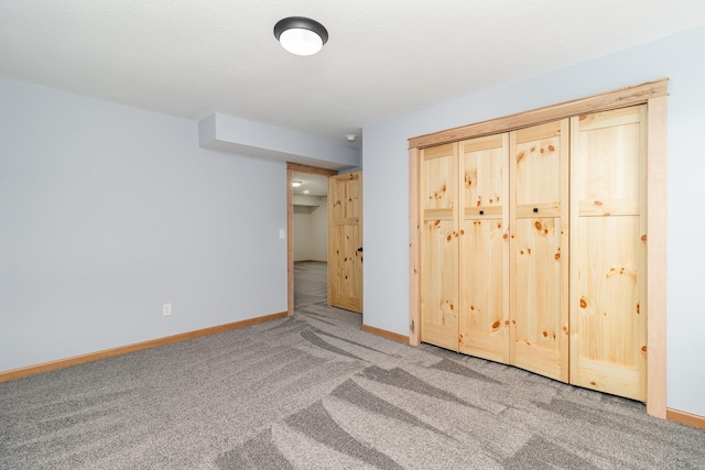 575 Elins Lake Rd SE, Cambridge, MN 55008 - unfurnished bedroom with carpet, baseboards, and a closet