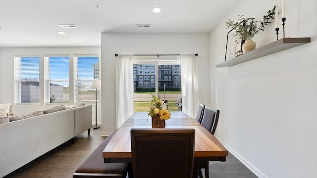 dining room featuring dark wood-style flooring, visible vents, and recessed lighting