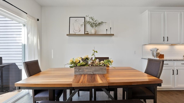 dining room with dark wood finished floors