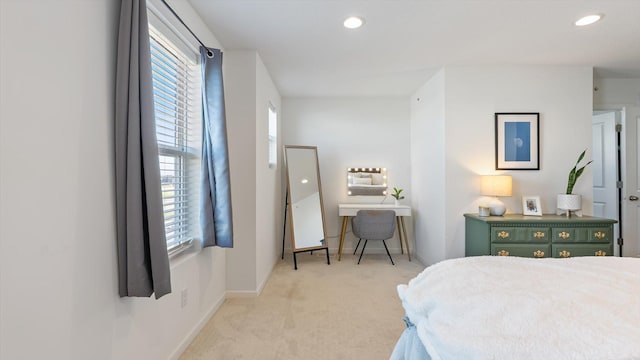 bedroom with baseboards, recessed lighting, and light colored carpet