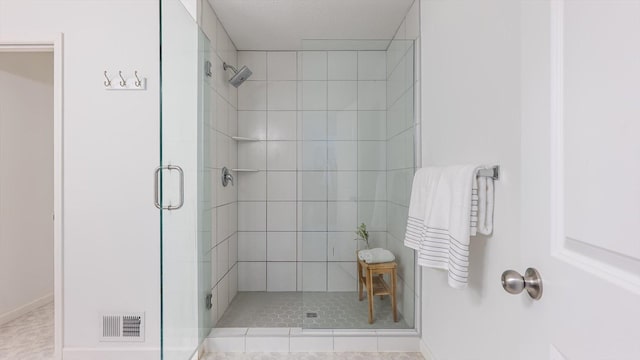 bathroom featuring visible vents and a stall shower