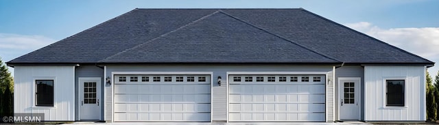 garage with concrete driveway