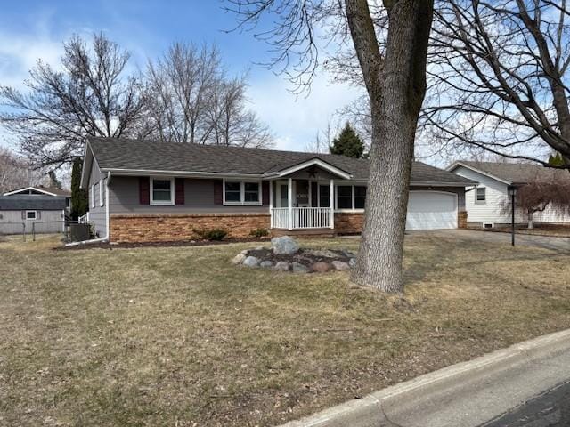 ranch-style home with a front yard, a porch, a garage, central air condition unit, and driveway