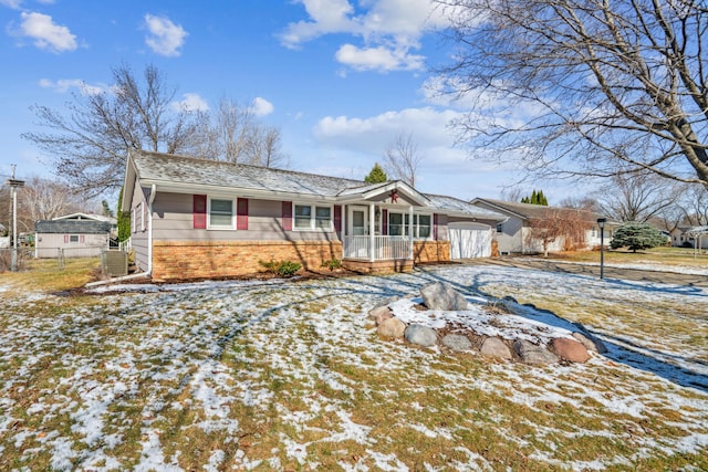 single story home featuring central AC unit, fence, and brick siding