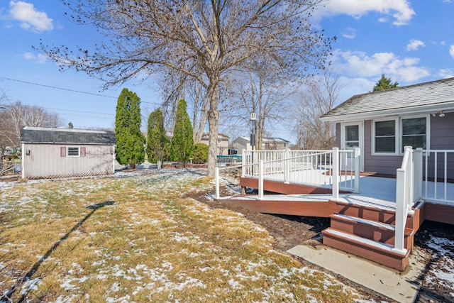 view of yard featuring an outbuilding and a wooden deck