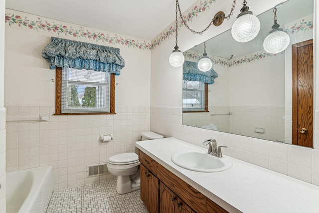 full bath with tile patterned flooring, a bathtub, toilet, visible vents, and tile walls