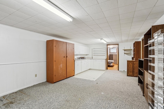 finished below grade area featuring light colored carpet