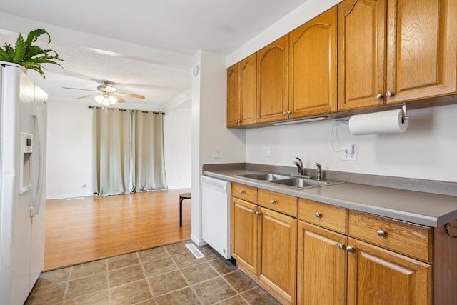 178 Mainzer St, West Saint Paul, MN 55118 - kitchen with a sink, white appliances, brown cabinetry, a ceiling fan, and wood finished floors