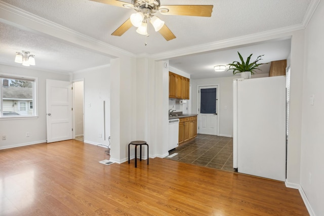 178 Mainzer St, West Saint Paul, MN 55118 - unfurnished living room featuring a ceiling fan, a textured ceiling, wood finished floors, and ornamental molding