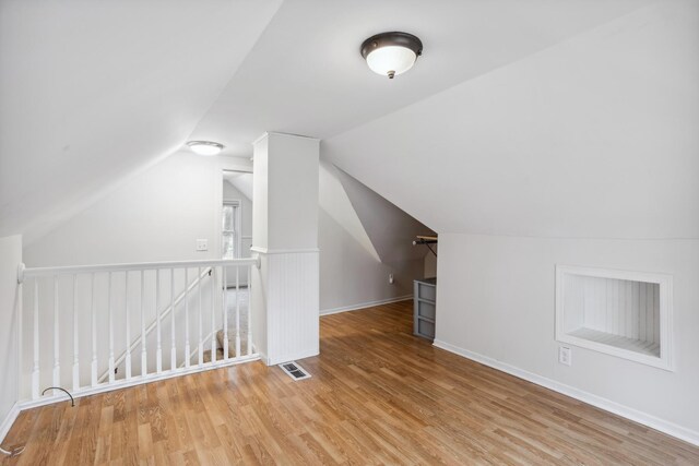 178 Mainzer St, West Saint Paul, MN 55118 - additional living space featuring baseboards, visible vents, wood finished floors, and lofted ceiling