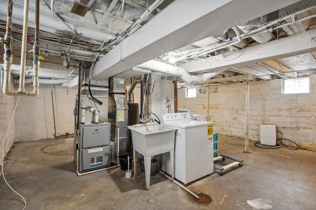 178 Mainzer St, West Saint Paul, MN 55118 - basement featuring plenty of natural light, heating unit, and washer / clothes dryer