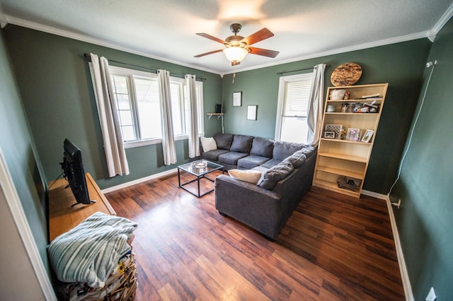 living area featuring baseboards, a ceiling fan, wood finished floors, and crown molding