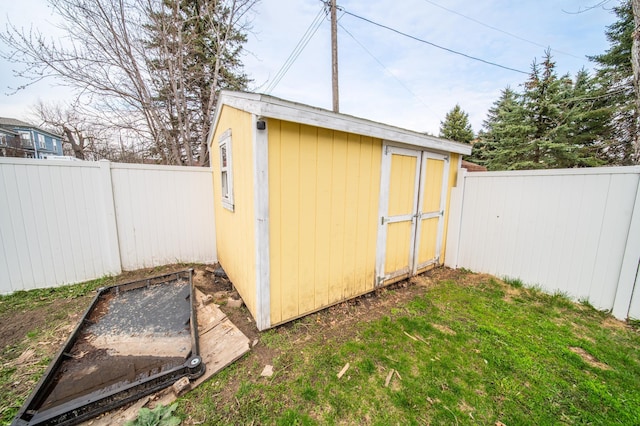 view of shed featuring a fenced backyard