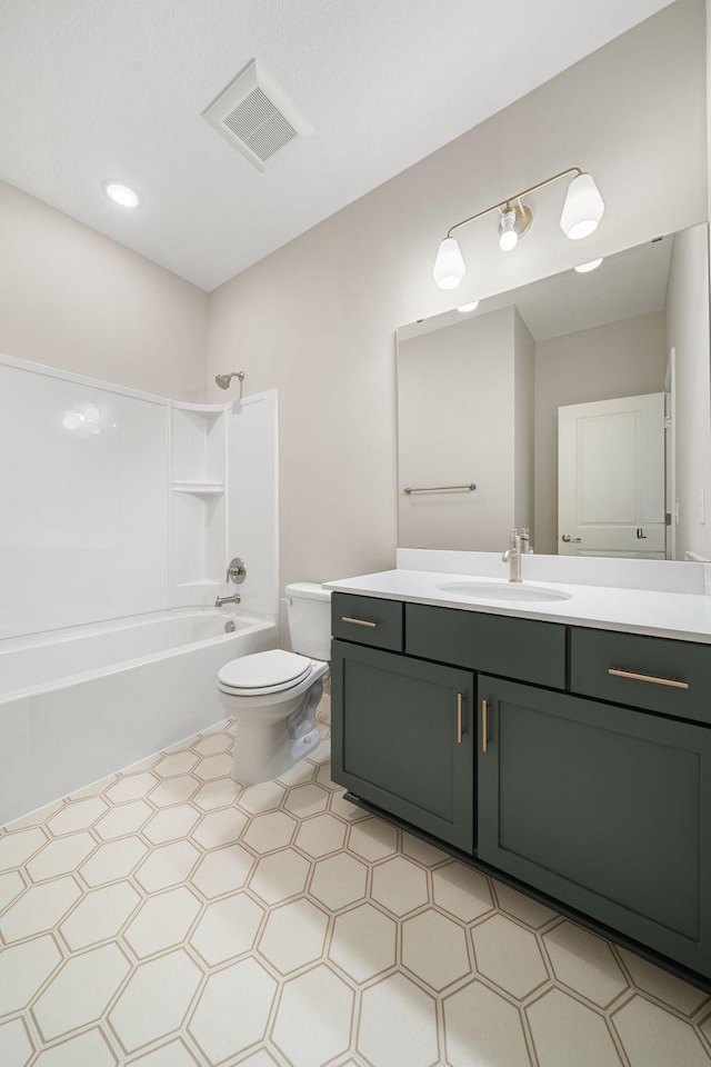 bathroom featuring vanity, toilet, tile patterned floors, visible vents, and shower / bathtub combination