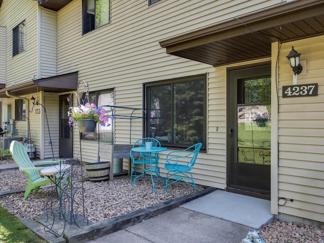 4237 Centerville Rd, Vadnais Heights, MN 55127 - property entrance featuring central air condition unit