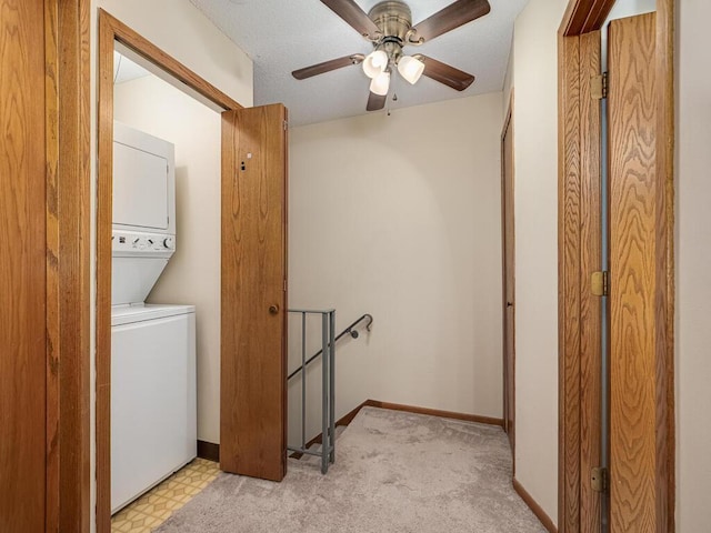 4237 Centerville Rd, Vadnais Heights, MN 55127 - laundry room featuring estacked washer and dryer and ceiling fan