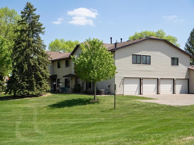 4237 Centerville Rd, Vadnais Heights, MN 55127 - view of front of house featuring an attached garage, driveway, and a front yard