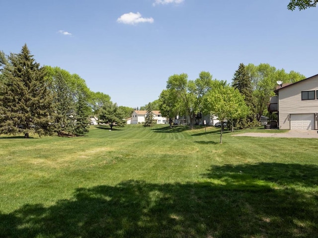 4237 Centerville Rd, Vadnais Heights, MN 55127 - view of green lawn with an attached garage