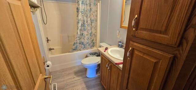 44629 Bear Trl, Lida Twp, MN 56572 - full bath with toilet, vanity, wood finished floors, and shower / bath combination with curtain
