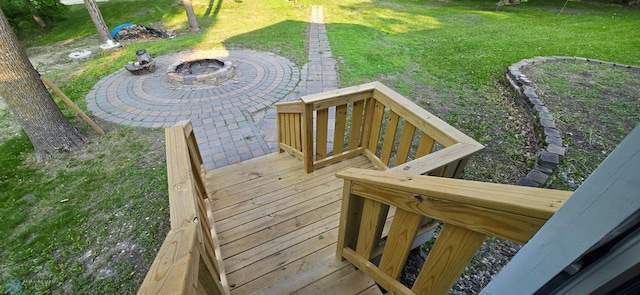 44629 Bear Trl, Lida Twp, MN 56572 - wooden terrace featuring a fire pit, a yard, and a patio