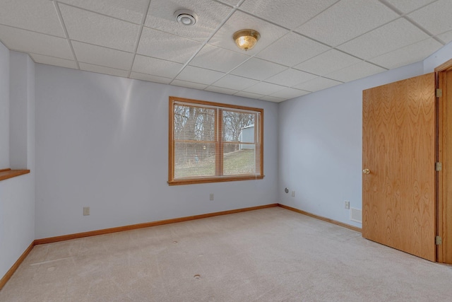 12114 260th St, Saint Cloud, MN 56301 - empty room featuring a drop ceiling, light colored carpet, and baseboards