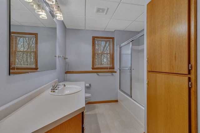 12114 260th St, Saint Cloud, MN 56301 - bathroom with a paneled ceiling, vanity, toilet, plenty of natural light, and baseboards