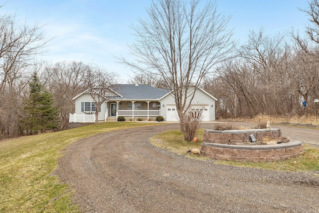 12114 260th St, Saint Cloud, MN 56301 - single story home with curved driveway, covered porch, a garage, and a front yard