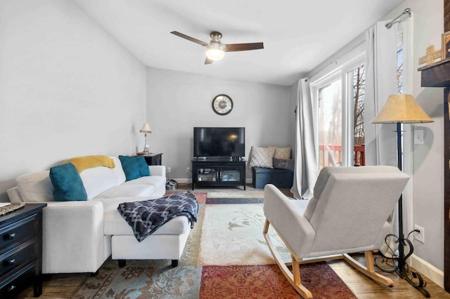 16137 Ahrens Hill Rd, Brainerd, MN 56401 - living room with a ceiling fan, baseboards, and wood finished floors