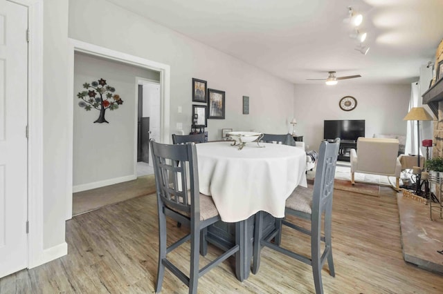 16137 Ahrens Hill Rd, Brainerd, MN 56401 - dining space featuring ceiling fan, light wood-style flooring, and baseboards