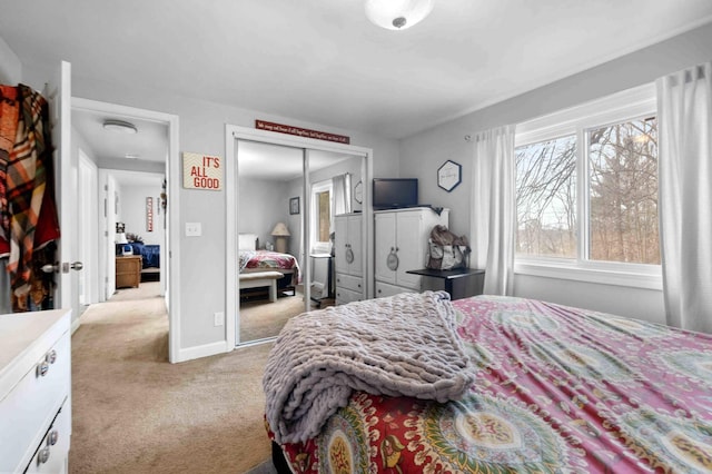 16137 Ahrens Hill Rd, Brainerd, MN 56401 - bedroom with light colored carpet, a closet, and baseboards