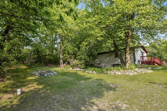 16137 Ahrens Hill Rd, Brainerd, MN 56401 - view of green lawn featuring a wooden deck