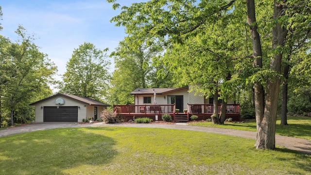 16137 Ahrens Hill Rd, Brainerd, MN 56401 - view of front of property with a garage, a deck, asphalt driveway, an outbuilding, and a front lawn