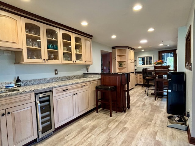 709 Riverside Dr N, North Hudson, WI 54016 - kitchen with beverage cooler, glass insert cabinets, open shelves, light wood-type flooring, and recessed lighting