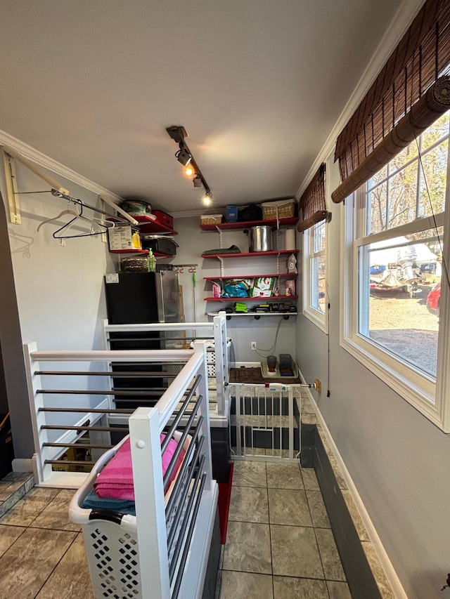 709 Riverside Dr N, North Hudson, WI 54016 - kitchen with rail lighting, baseboards, and ornamental molding