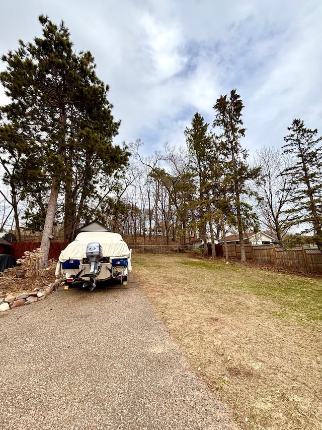 709 Riverside Dr N, North Hudson, WI 54016 - view of yard featuring fence and gravel driveway