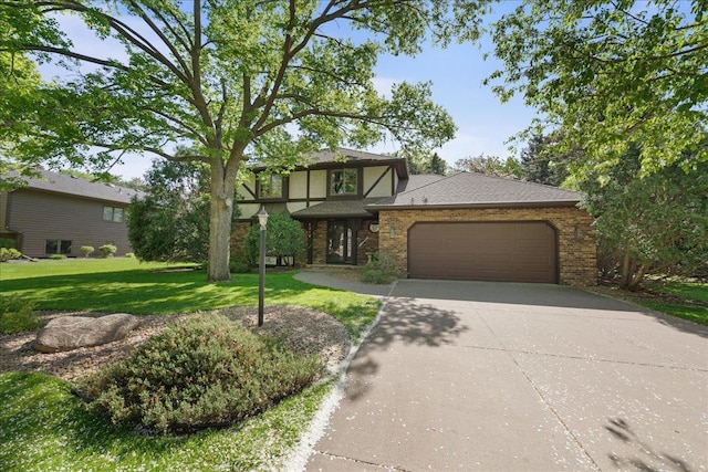 1317 Waterford Rd, Woodbury, MN 55125 - view of front of house featuring driveway, a garage, a front yard, and brick siding