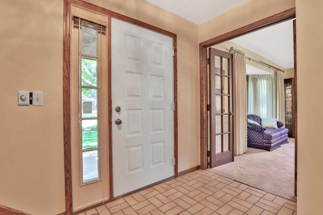 1317 Waterford Rd, Woodbury, MN 55125 - foyer with brick patterned flooring and baseboards