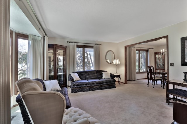 1317 Waterford Rd, Woodbury, MN 55125 - living area featuring carpet floors, a chandelier, and baseboards