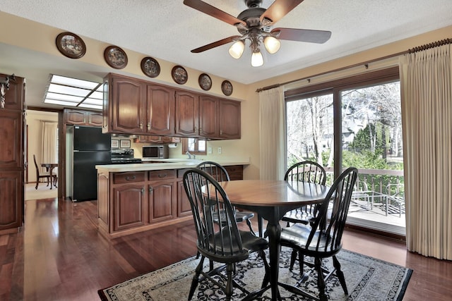 1317 Waterford Rd, Woodbury, MN 55125 - dining space with a ceiling fan, a textured ceiling, and dark wood-style floors